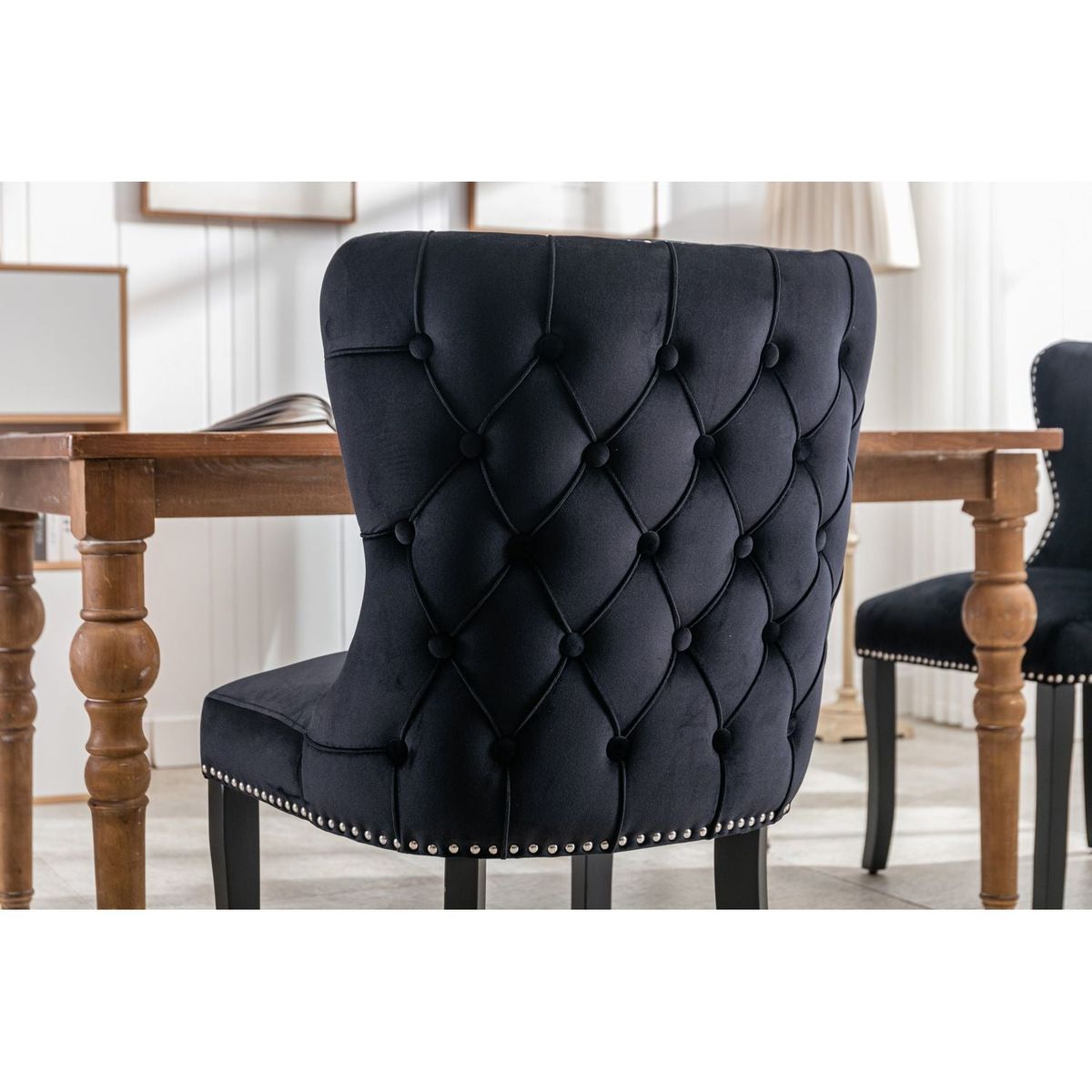 Set of 2 Black Velvet upholstered wing-back dining chair with backstitching nailhead trim and solid wood legs