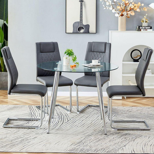 Table and chair set. (1 table+4 gray chairs) Round dining table with a 40 inch diameter glass tabletop and silver plated metal legs. 4 gray PU chairs DT-1164 001