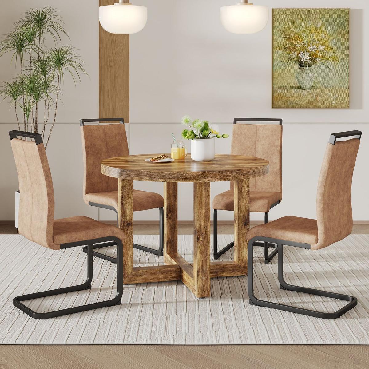 A modern and practical circular dining table. Made of MDF tabletop and wooden MDF table legs. 4-piece technology cloth high backrest cushion side chair, C-shaped tube black metal legs.