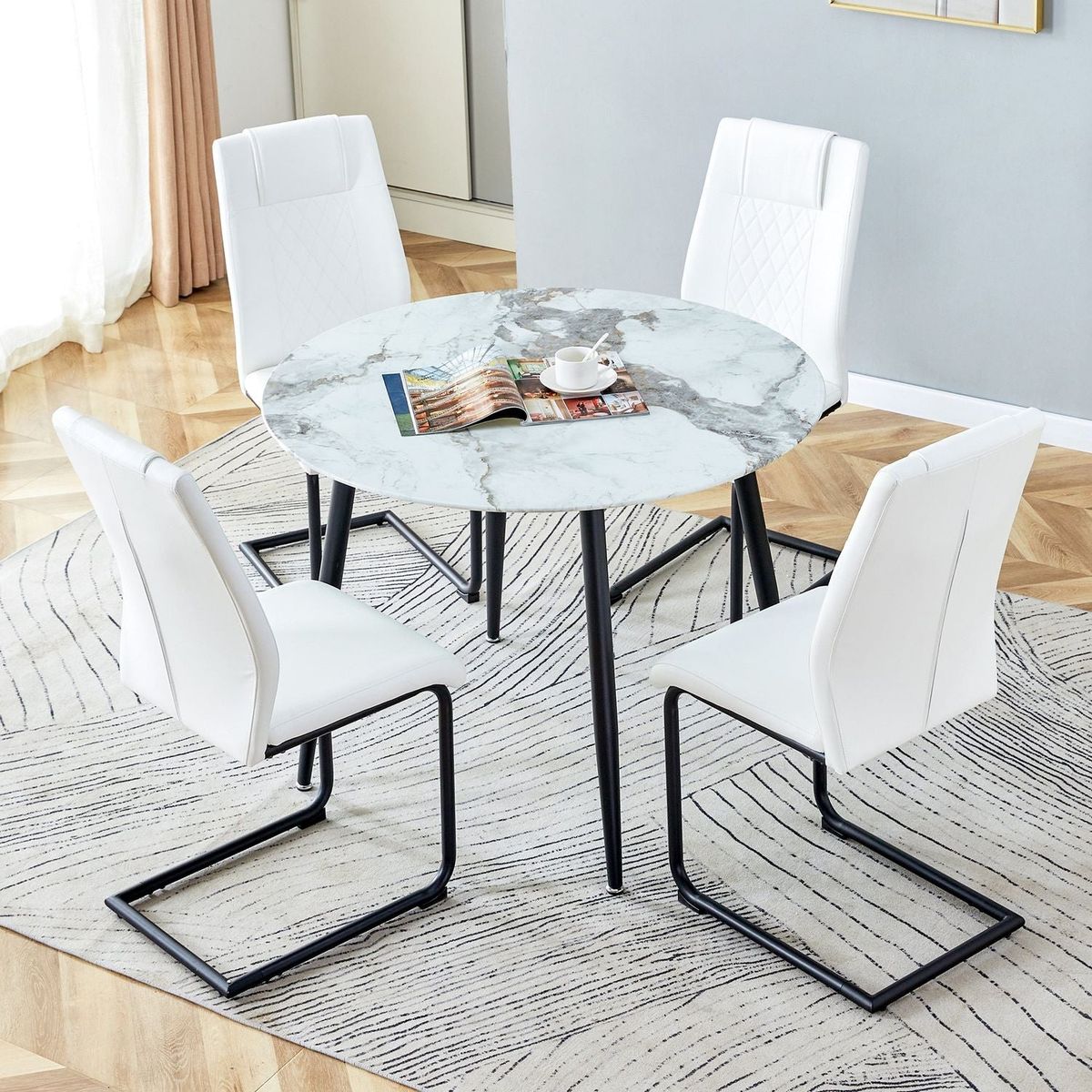 Table and chair set. Large modern white imitation marble patterned round table with black metal legs. Nice minimalism, comfortable seats and black metal legs.