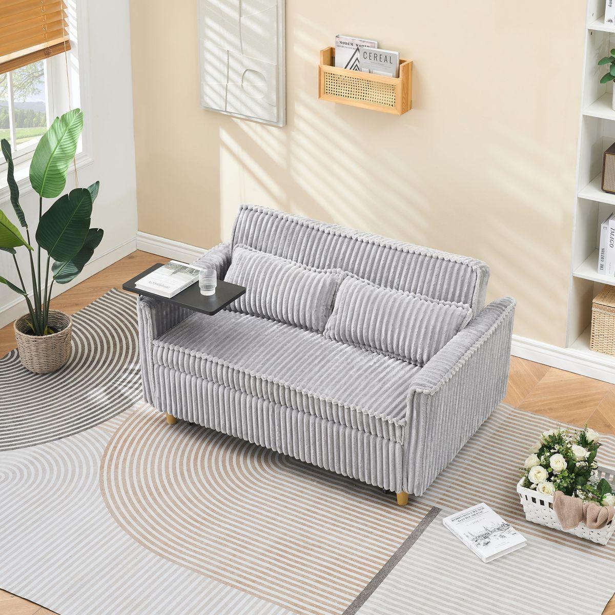 The pull-out and push-in gray corduroy sofa with dual functions, equipped with a movable tabletop and USB ports, is suitable for use in living rooms and bedrooms.