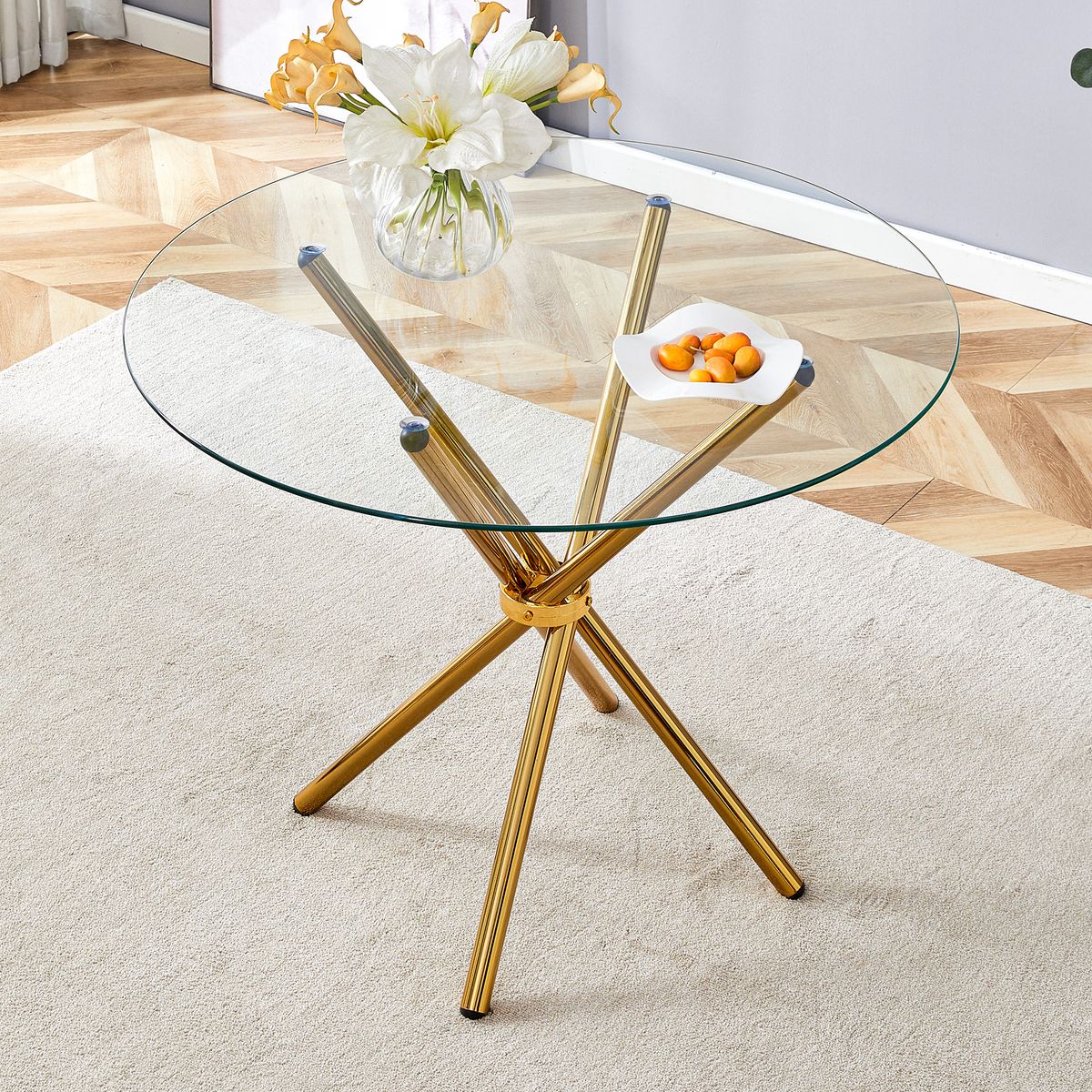 Round clear glass dining table with a unique shape for 4-6 people, with ring-shaped gathered gold metal legs, suitable for desks, kitchens, terraces, dining rooms.