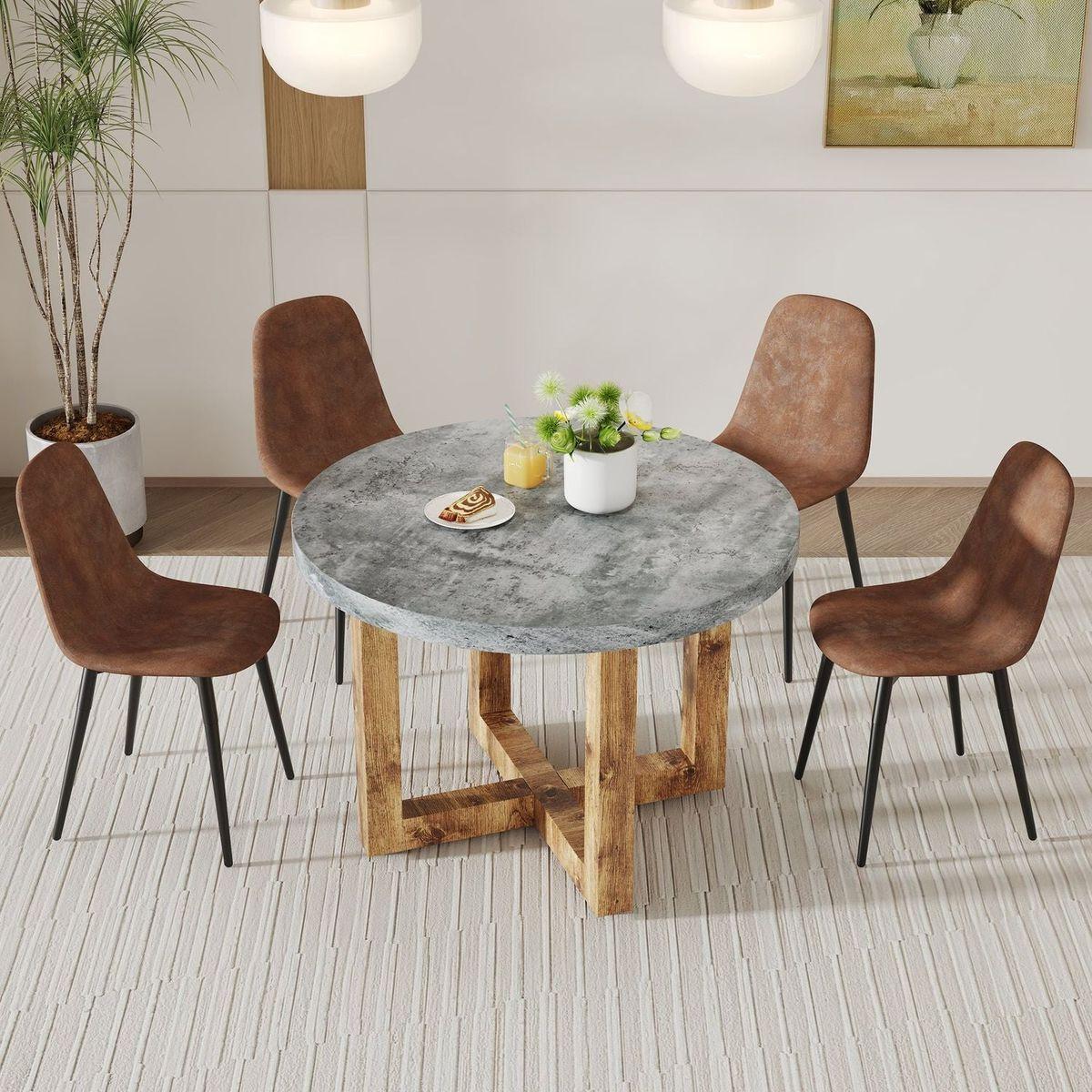 A modern and practical circular dining table. Made of MDF tabletop and wooden MDF table legs. A set of 4 brown cushioned chairs.